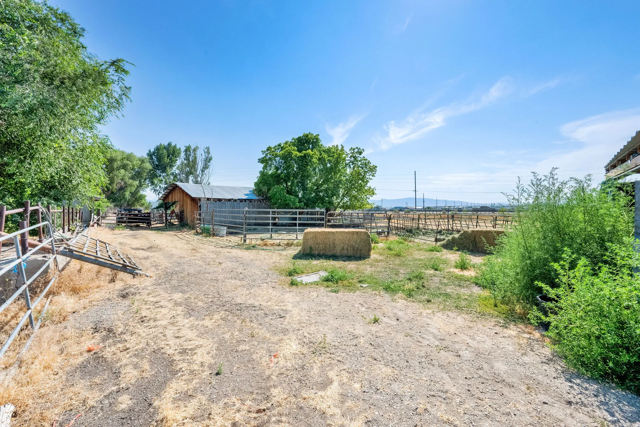 View of yard with an outdoor structure, an exterior structure, and a view of countryside