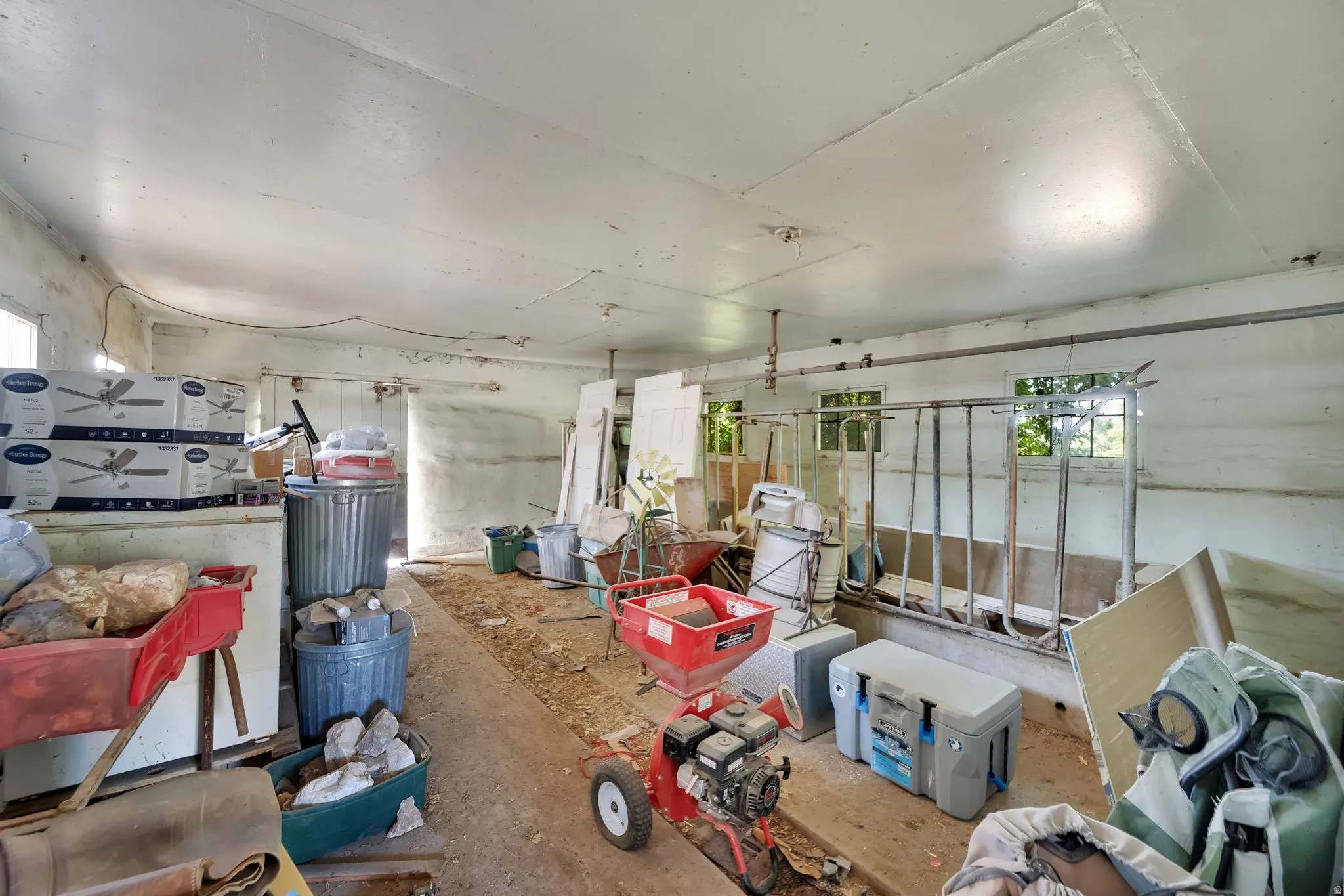 Miscellaneous room featuring healthy amount of natural light and concrete flooring