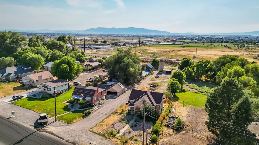 Aerial perspective of suburban area featuring a mountainous background