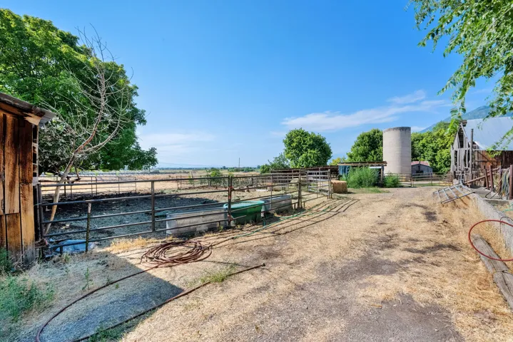 View of yard featuring an outdoor structure and an exterior structure