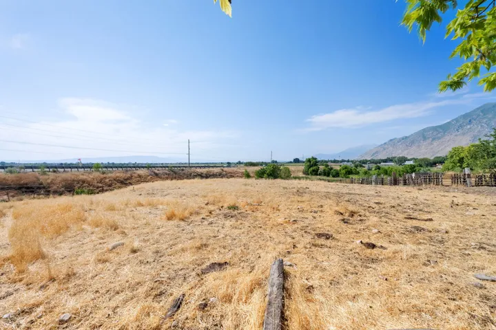 View of mountain backdrop with rural landscape