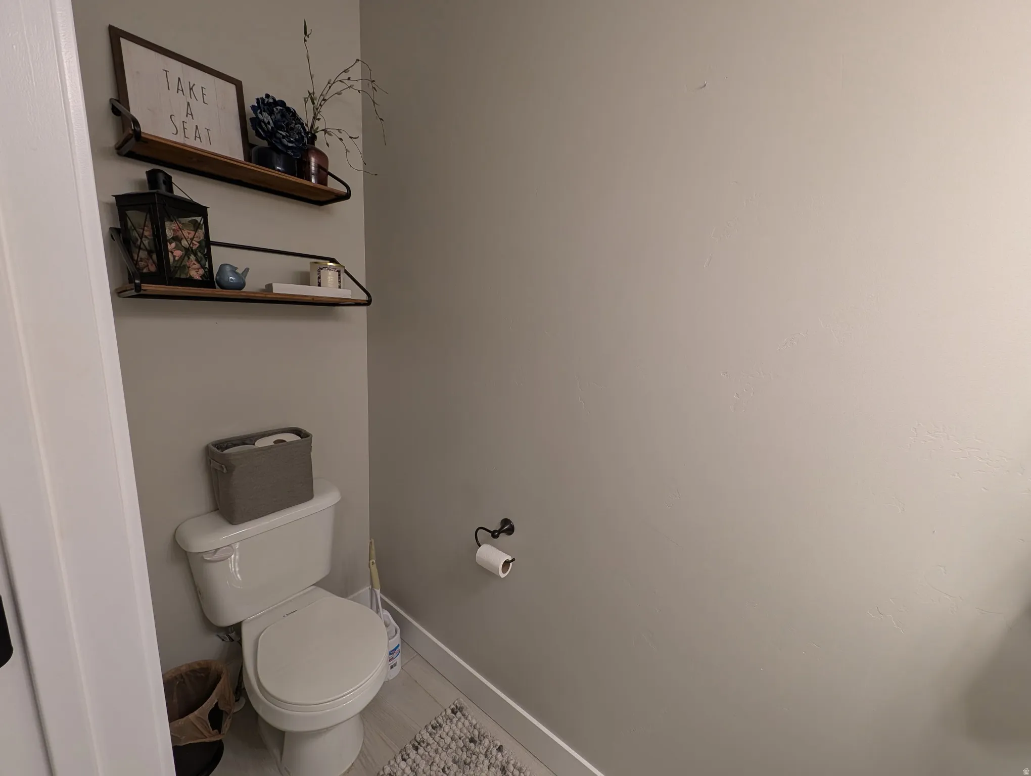 Bathroom with toilet and baseboards