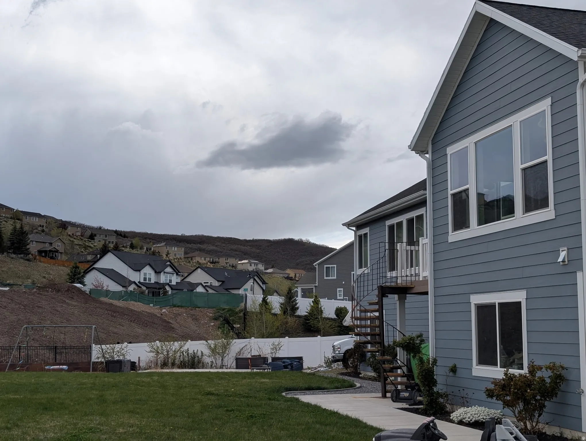 View of yard featuring a residential view and a balcony