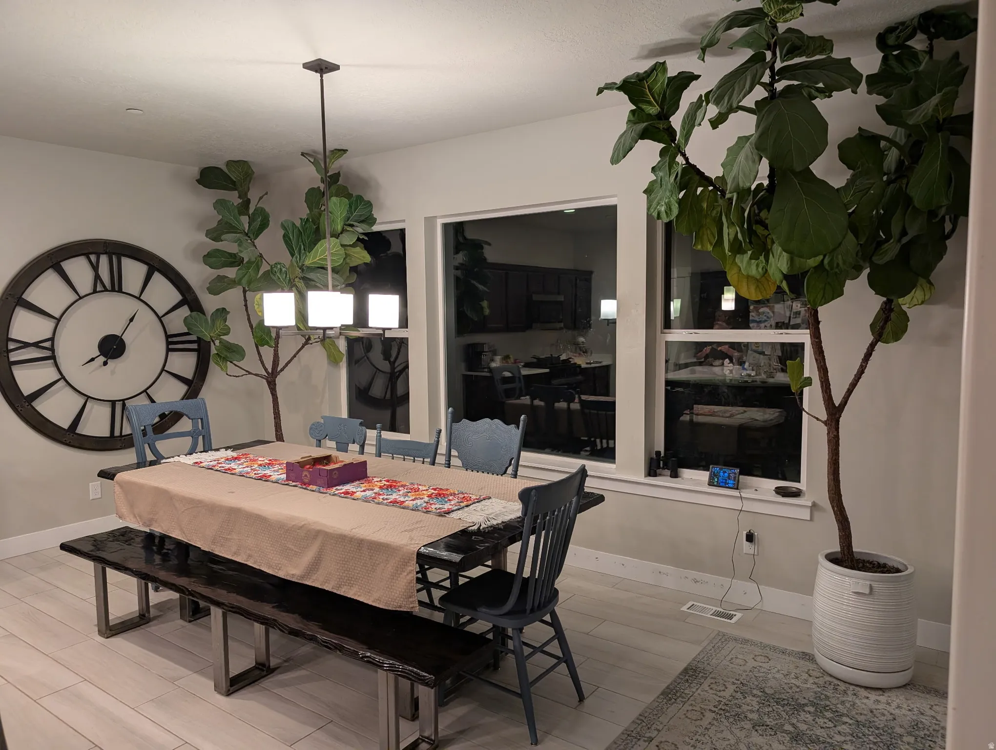 Dining space featuring wood finished floors and baseboards