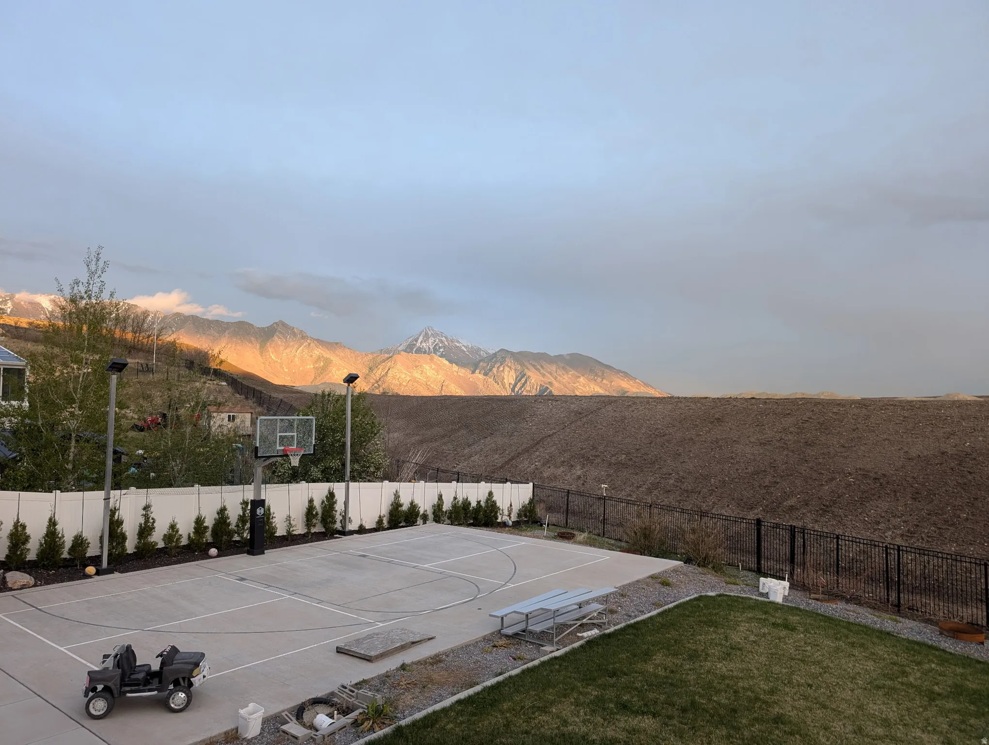 View of basketball court with basketball court and a mountain view