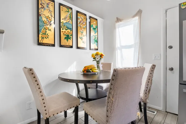 Dining area with wood tiled floors and baseboards