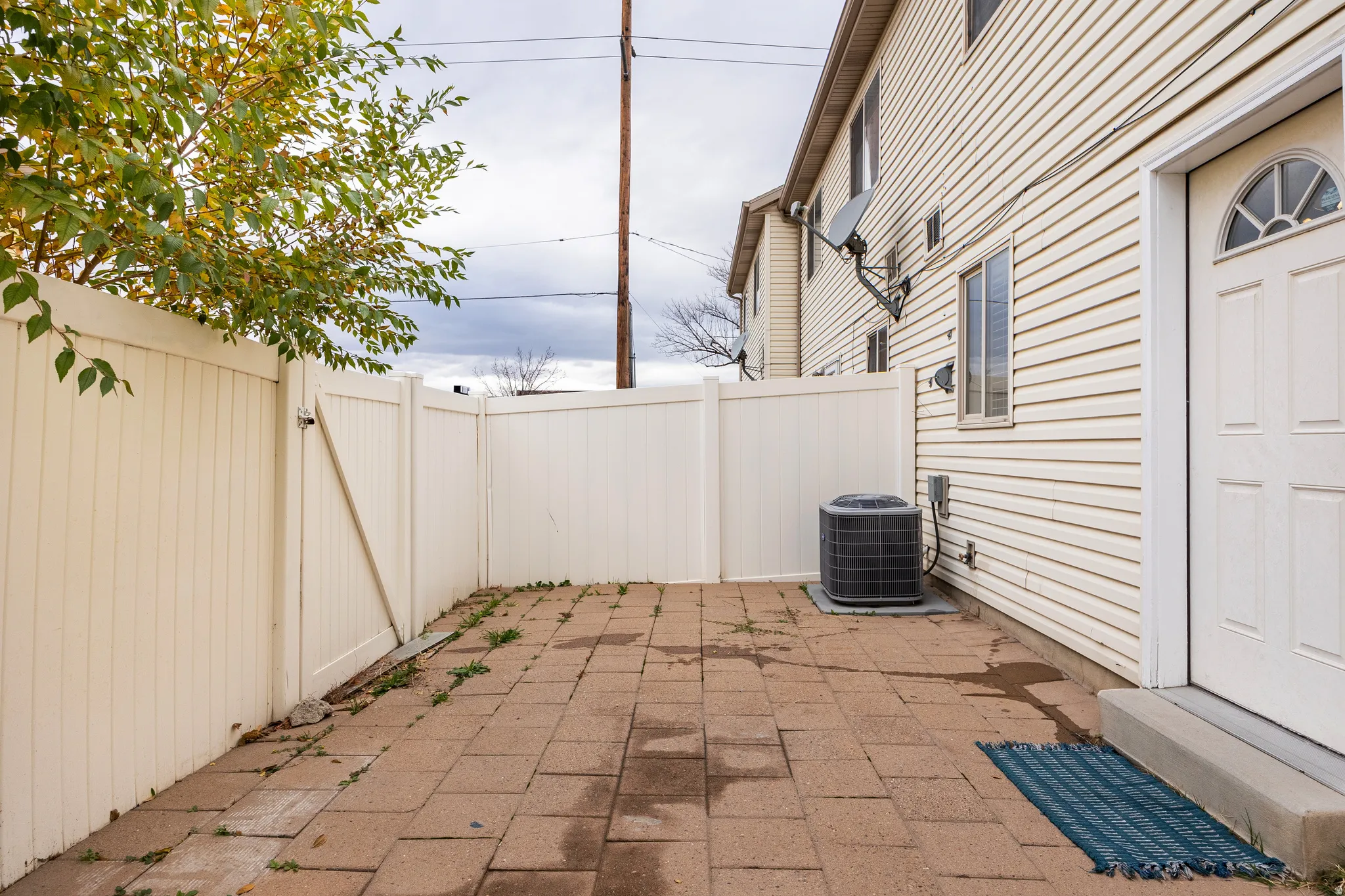 View of back patio / terrace with a gate