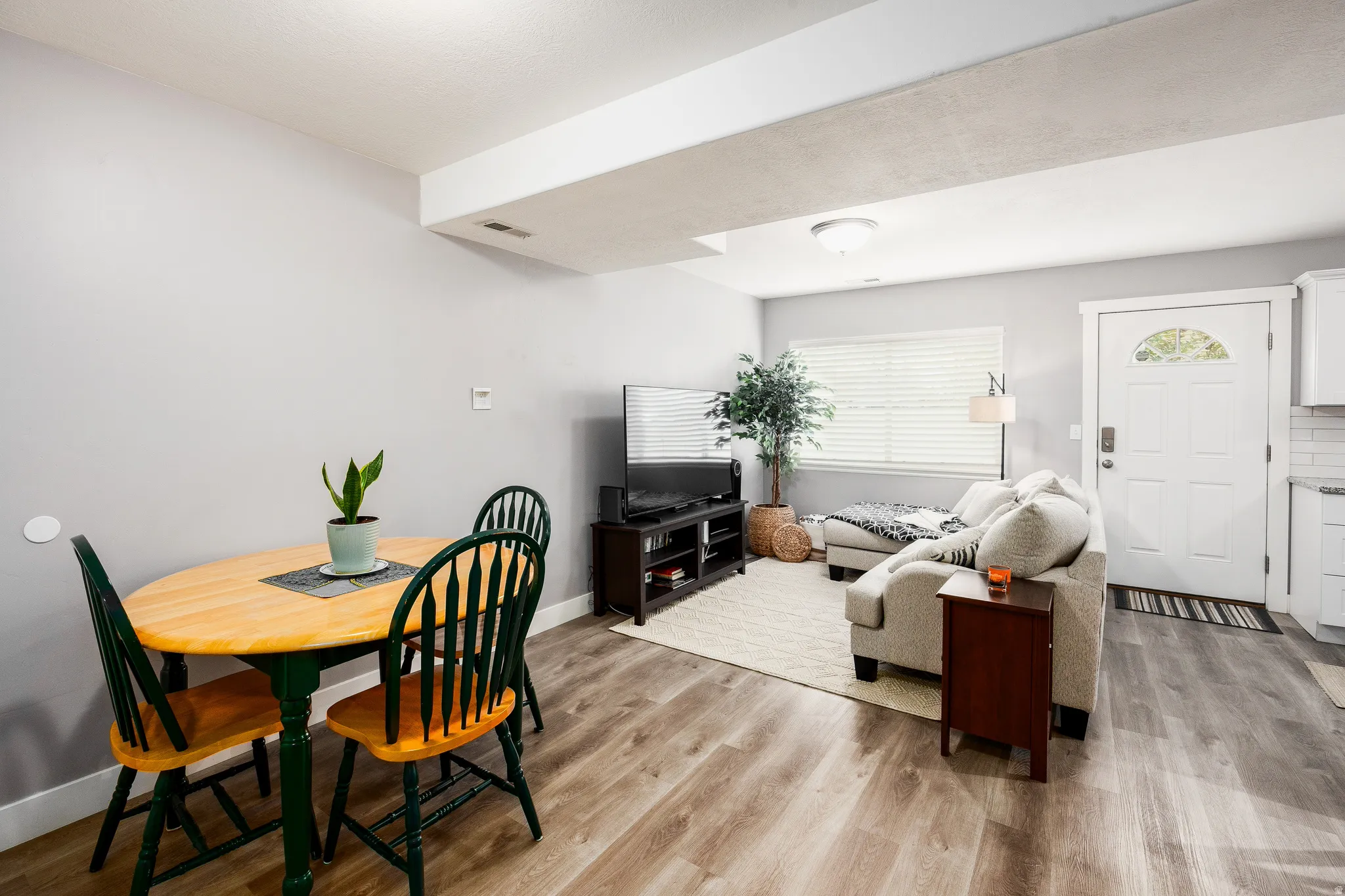 Dining and living area with LVP floors