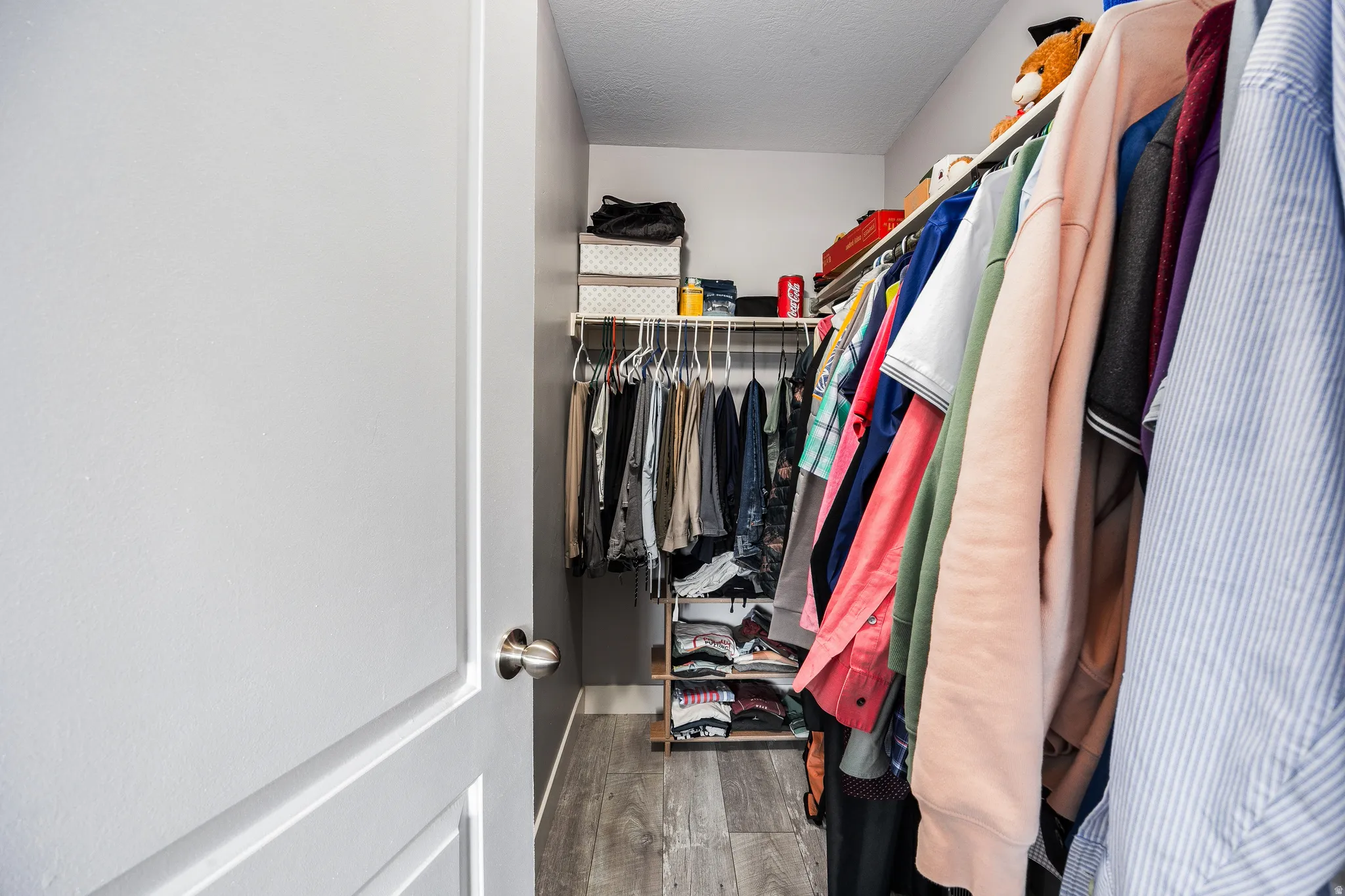 Primary bedroom walk-in closet