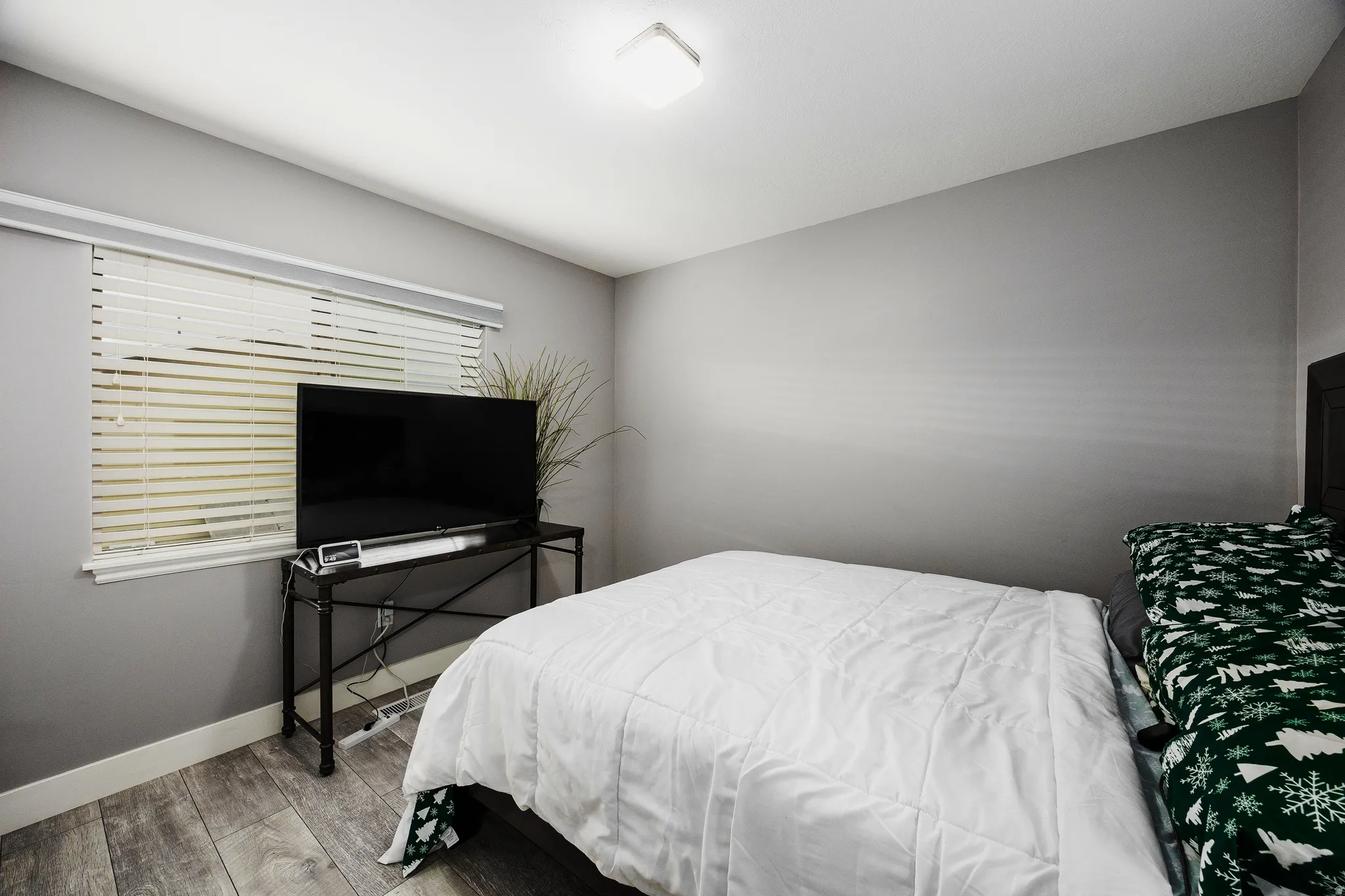 Bedroom #3 upstairs, with baseboards and LVP flooring