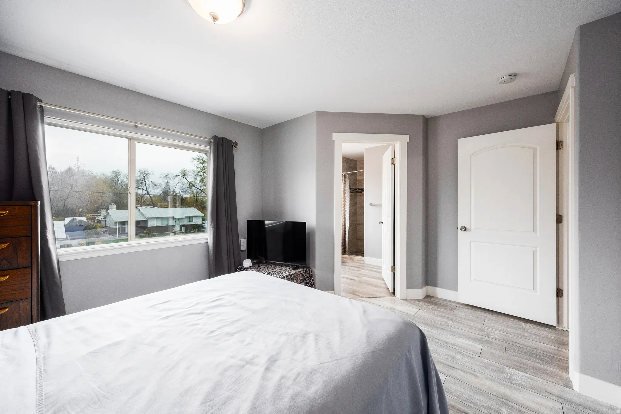 Spacious primary suite featuring large window