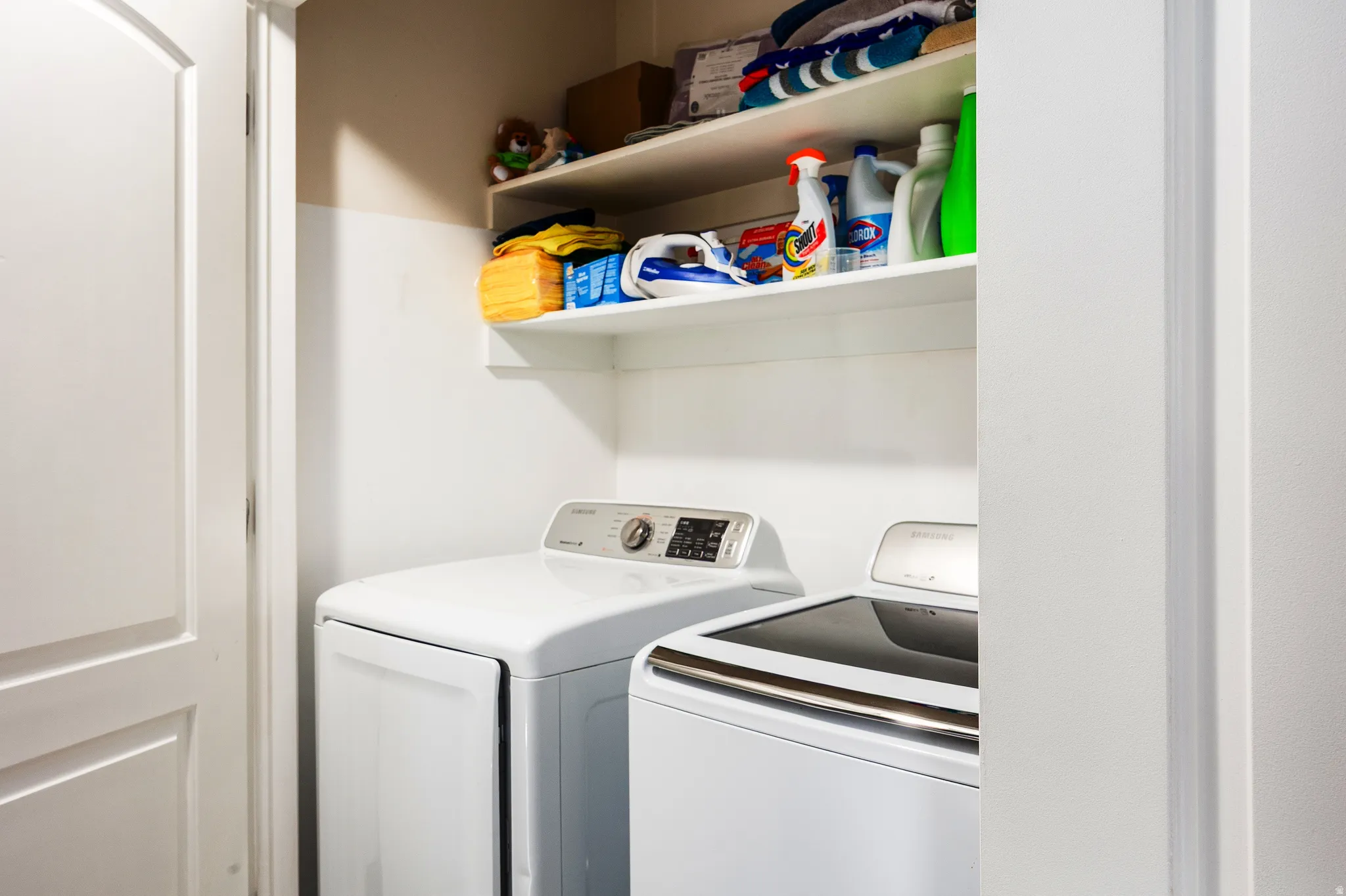 Laundry area upstairs, featuring included washer and dryer