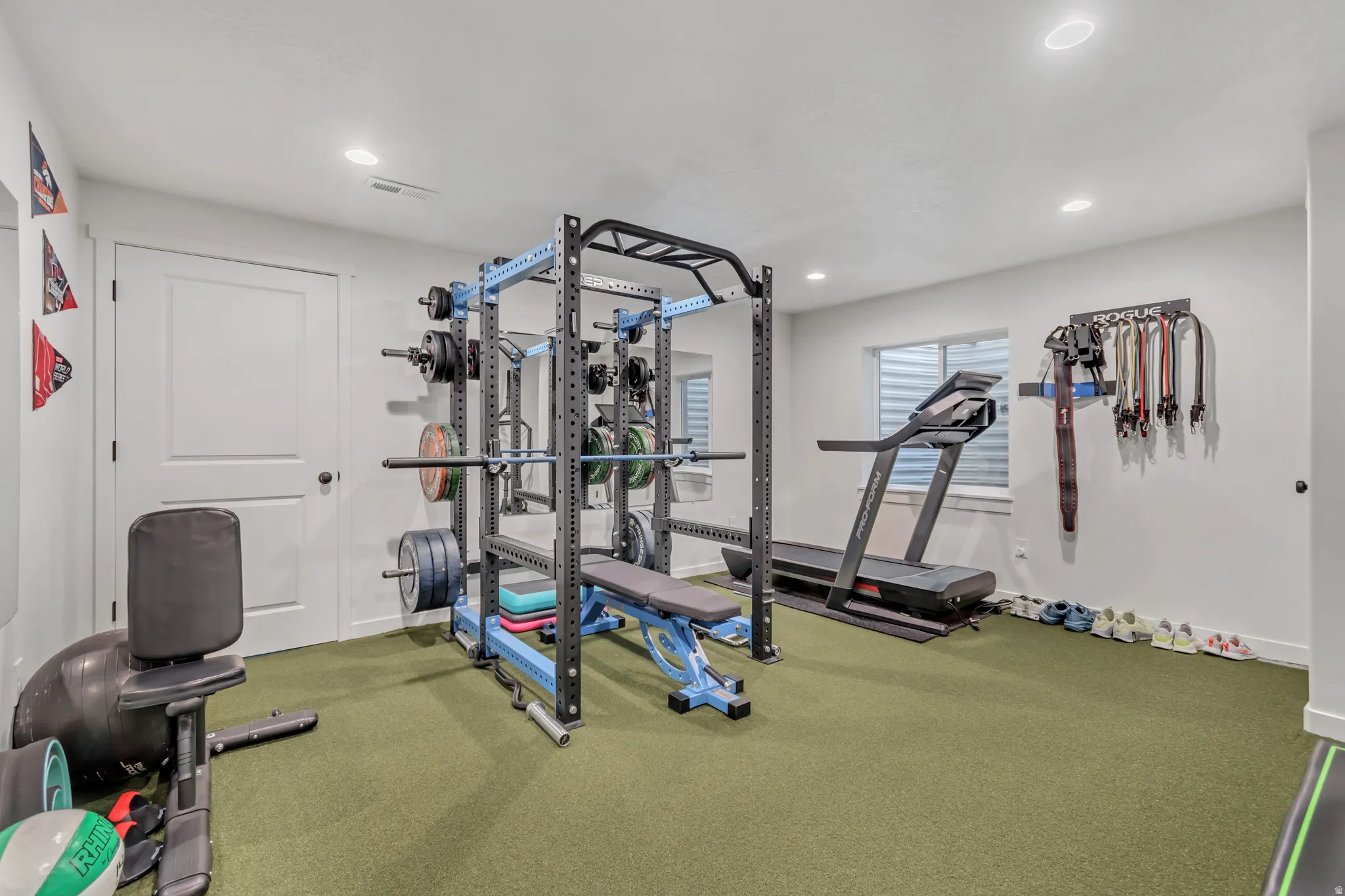 Exercise room featuring recessed lighting