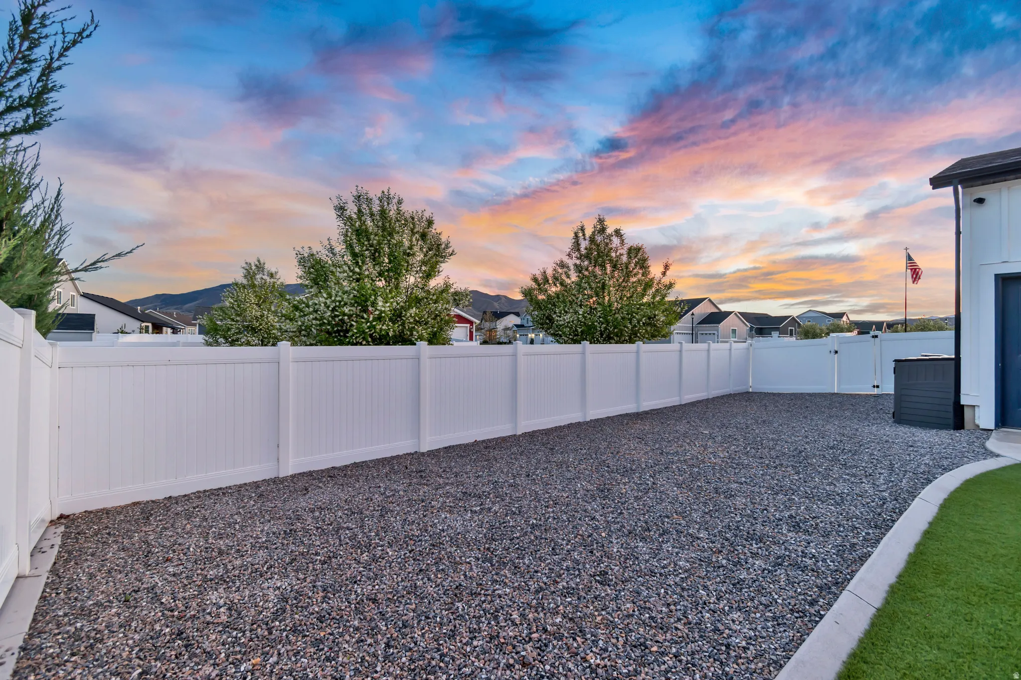 Fenced side yard boasts plenty of room to park all your toys!