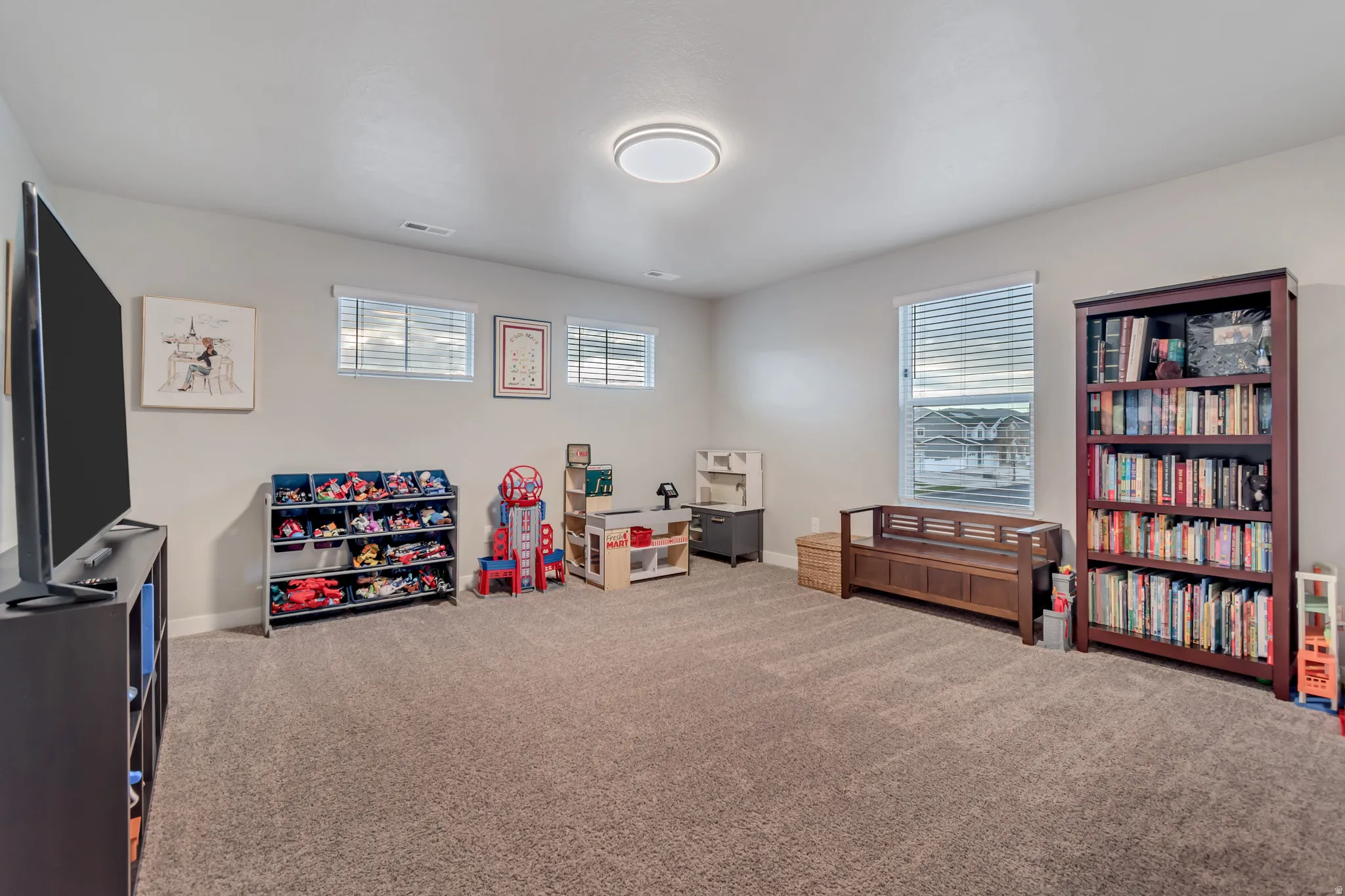 Spacious upstairs loft—ideal for a playroom, home office, or cozy TV/game room.