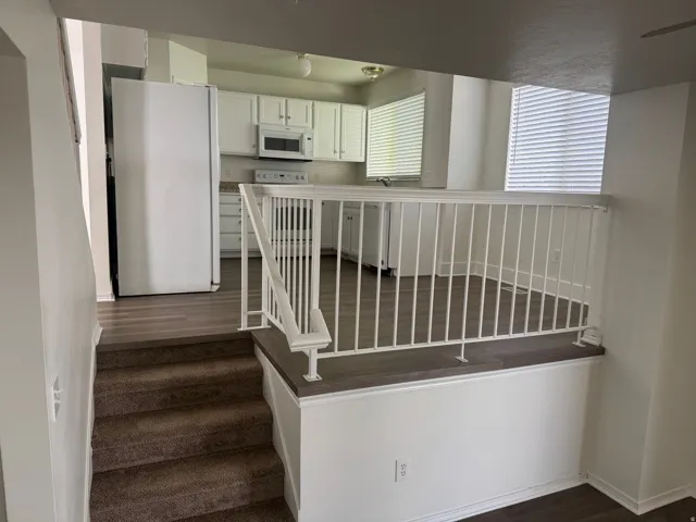 Stairway with wood finished floors