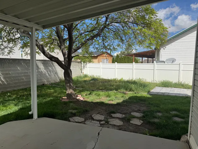 Fenced backyard featuring a patio area