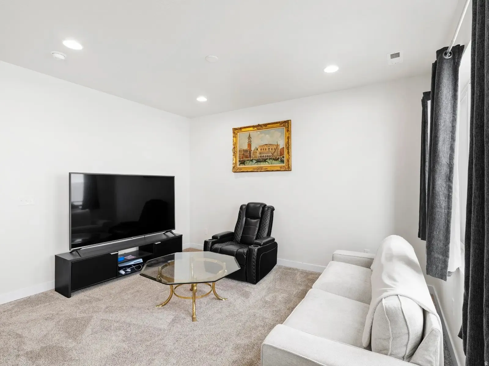 Carpeted living room featuring recessed lighting