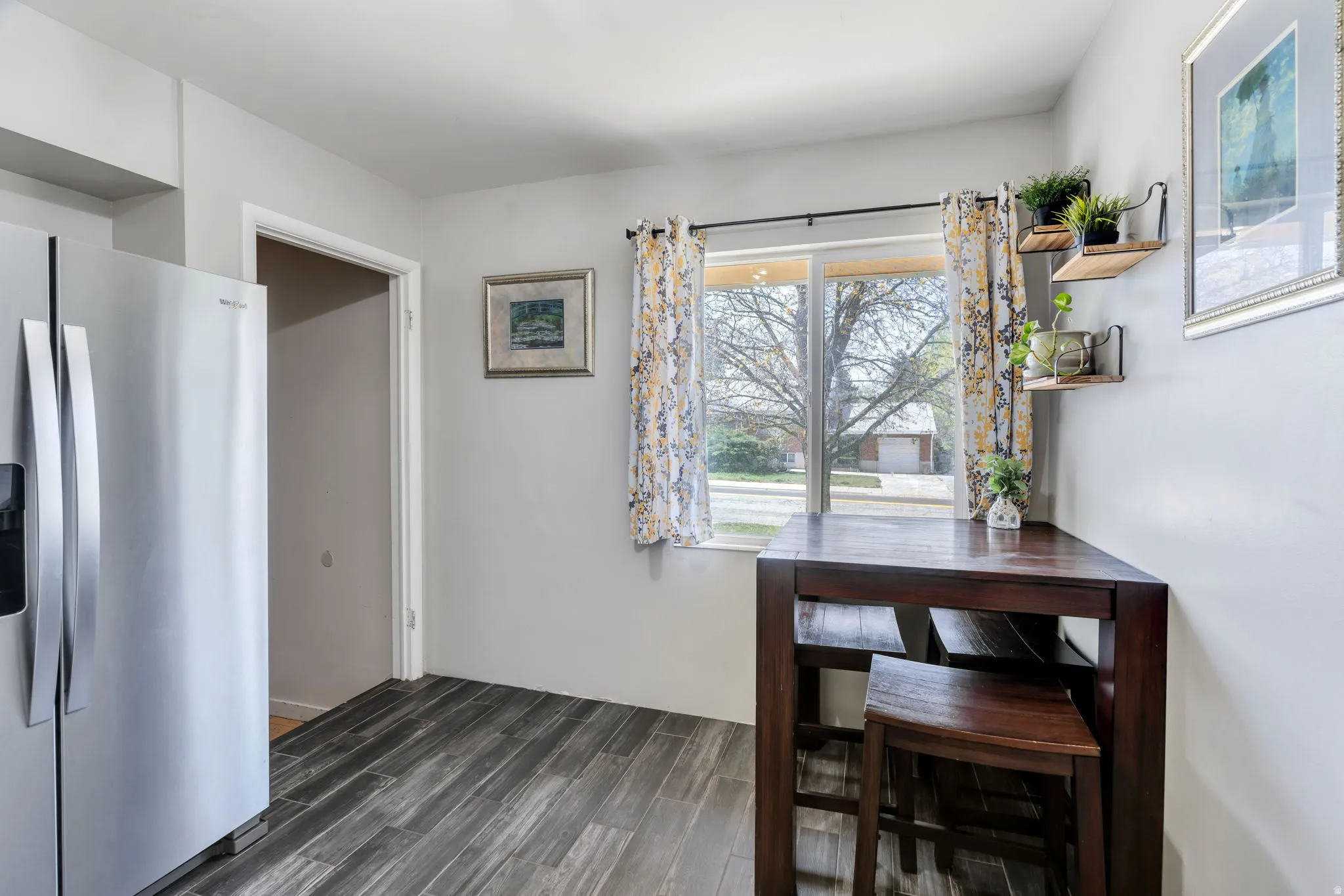 Dining room with dark wood-type flooring