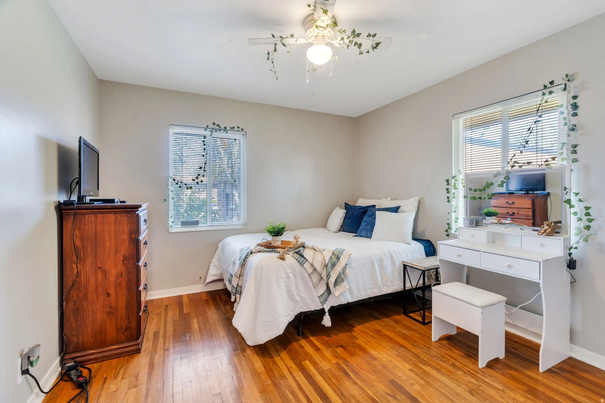 Bedroom featuring baseboards and light wood-type flooring