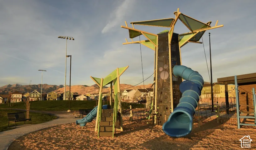 Daybreak Community jungle gym with a residential view and a mountain view