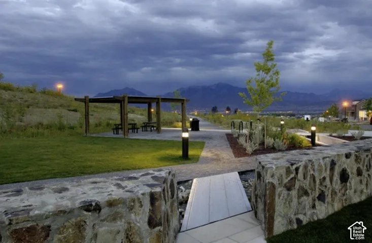 Surrounding Daybreak community featuring a patio area and a mountain view
