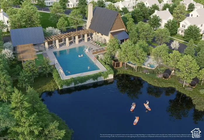 Expansive recreational area featuring a large swimming pool, covered lounge areas, and a waterfront setting