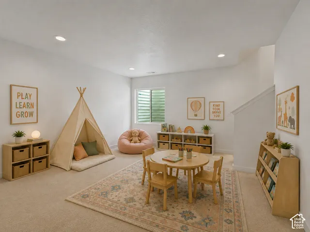 Recessed ceiling lighting, light-colored carpeting, a window, and a staircase, AI staged