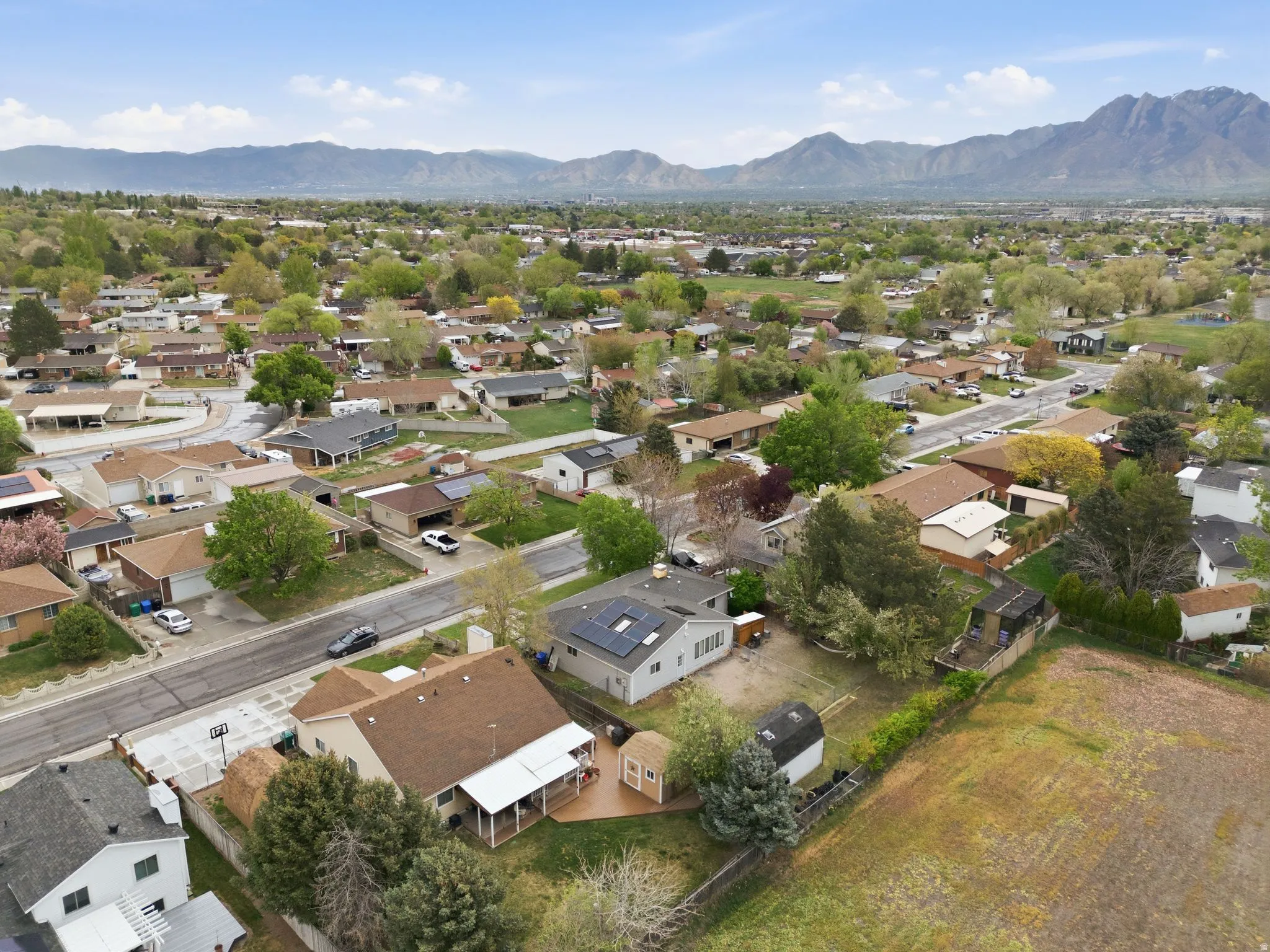 Aerial perspective of suburban area with a mountain backdrop