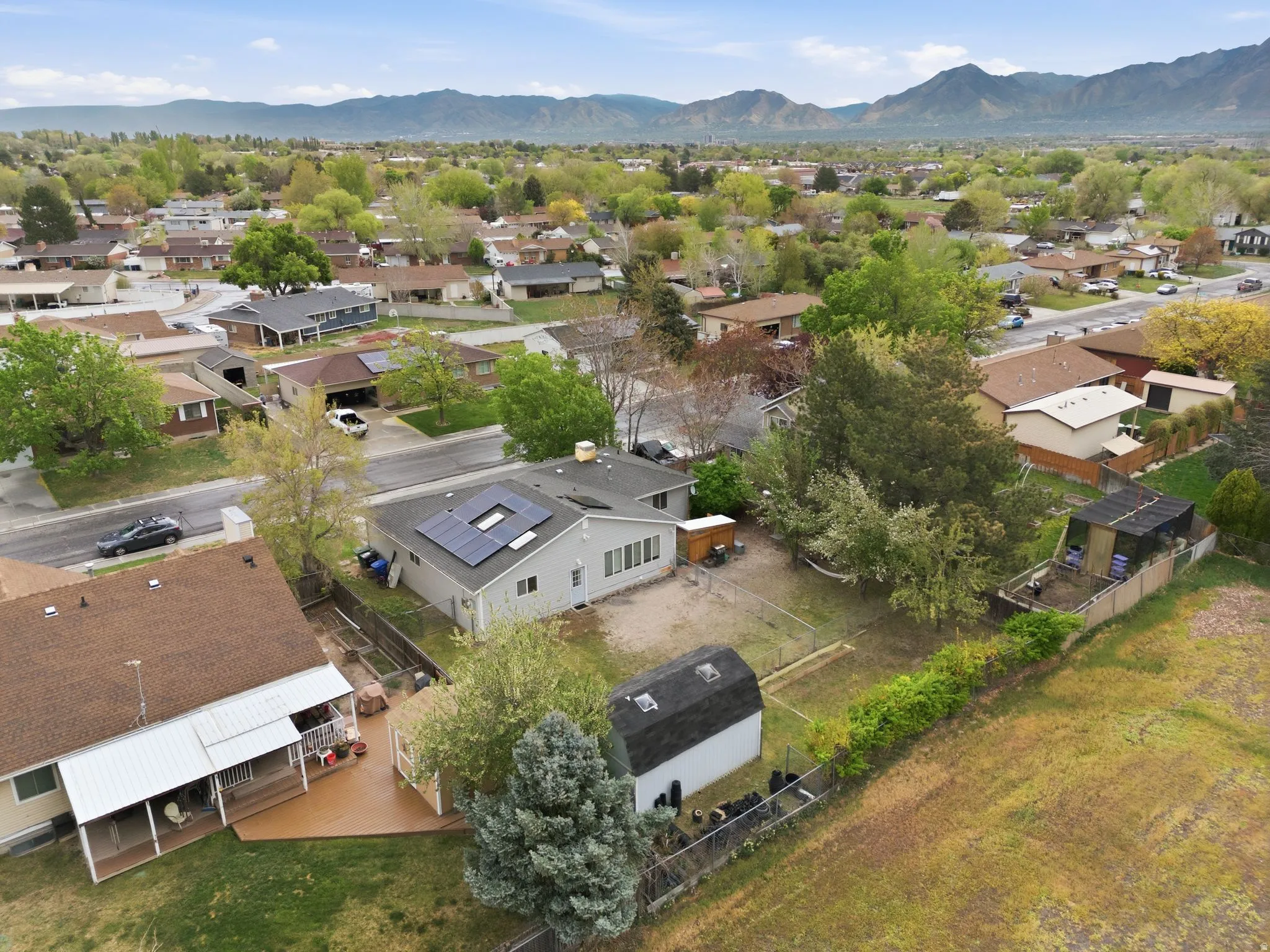 Aerial view of residential area featuring a mountainous background