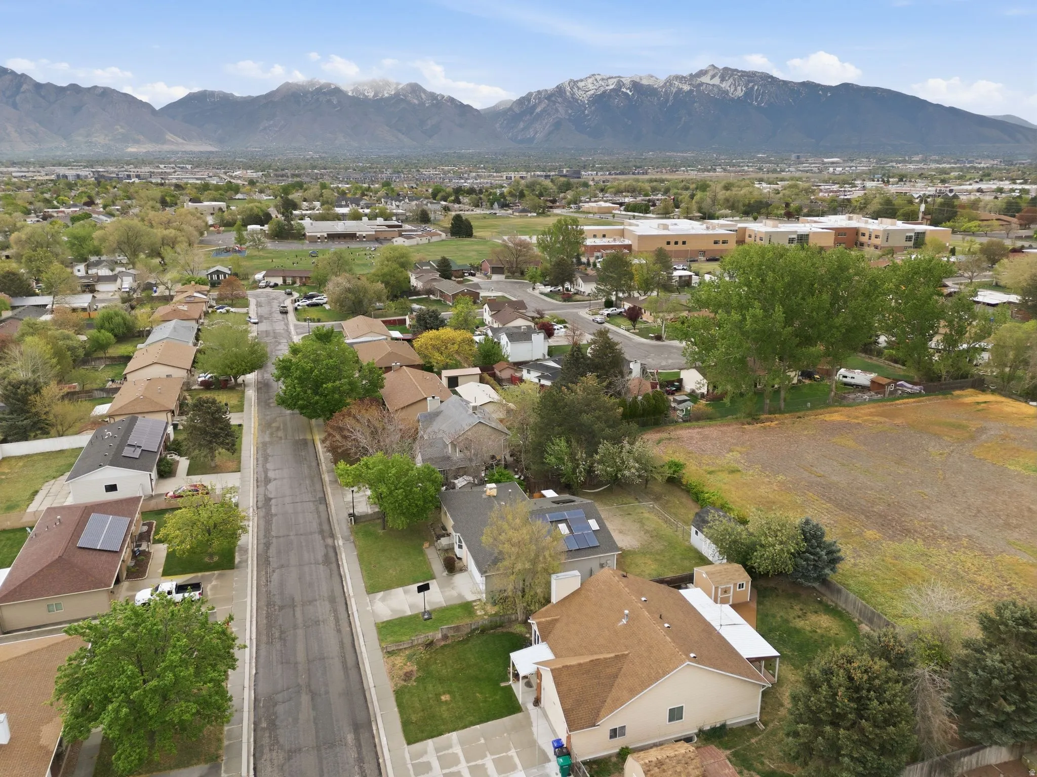 Aerial perspective of suburban area featuring a mountain backdrop