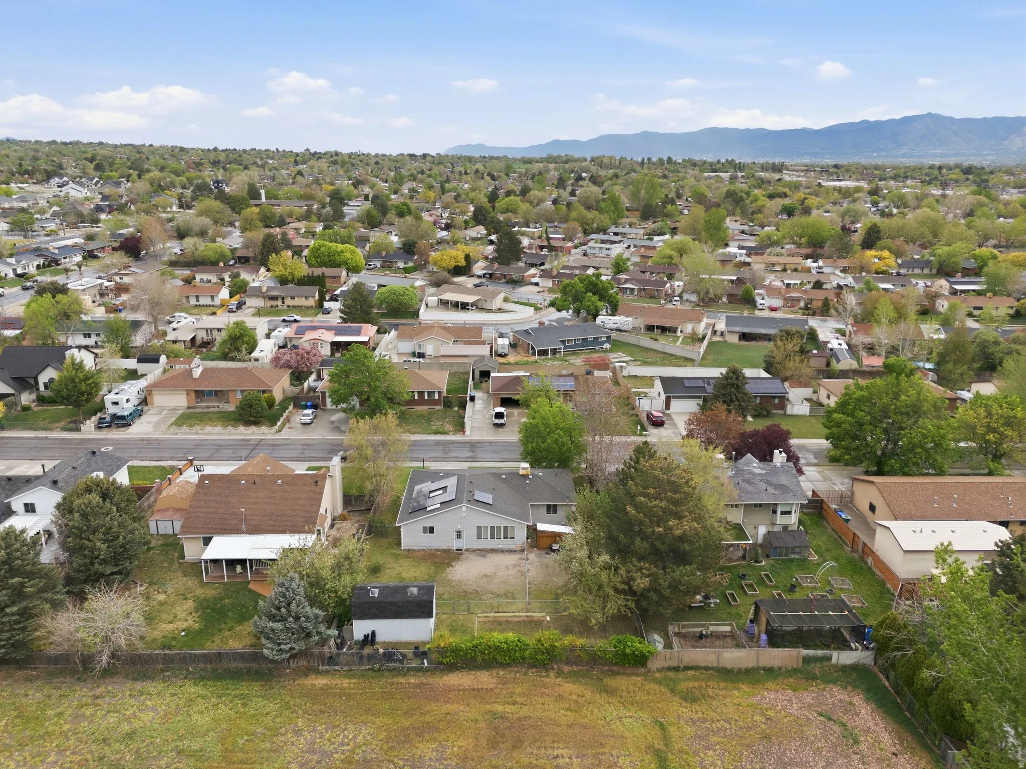 Aerial view of residential area featuring a mountain backdrop