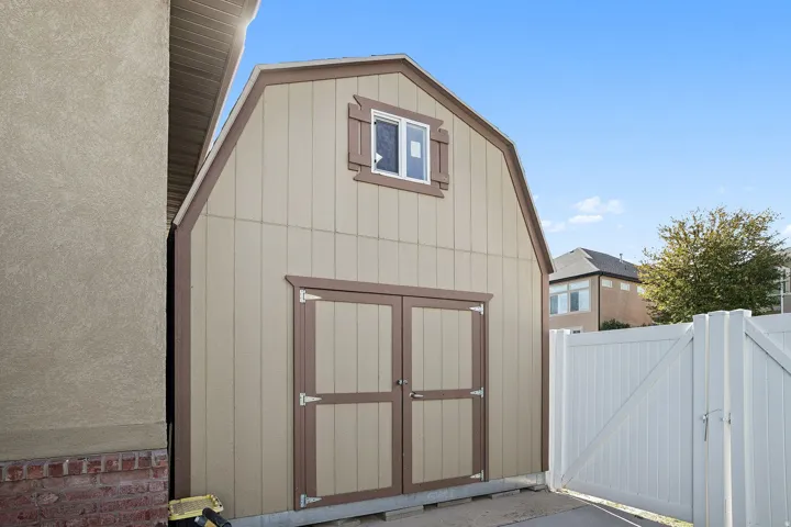 View of shed with a gate