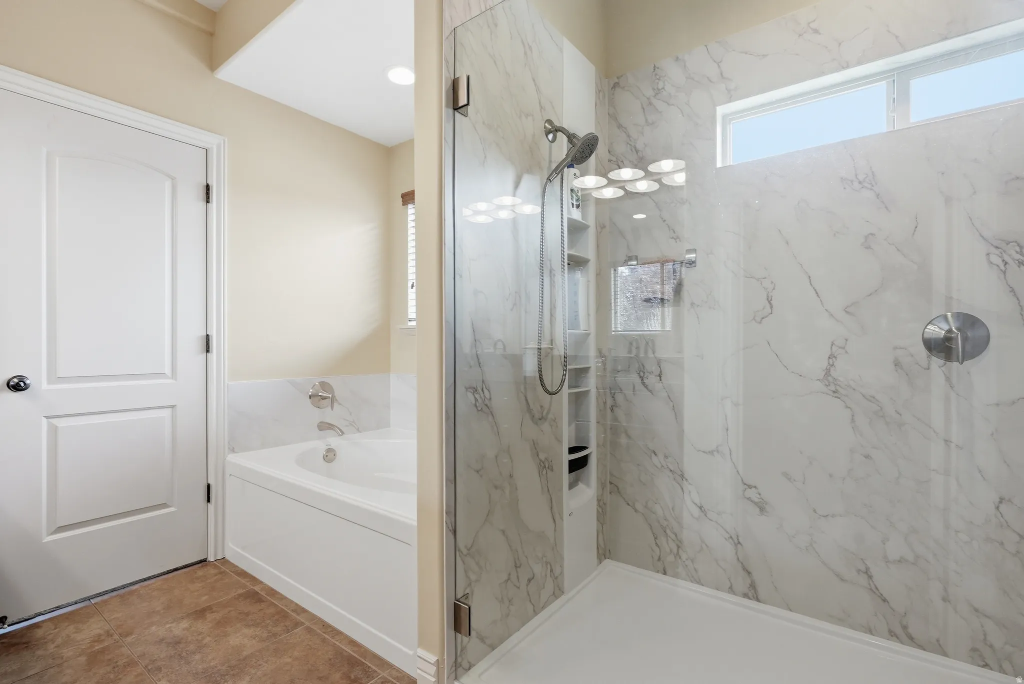 Primary bathroom with separate walk-in shower and new, never-used soaking tub