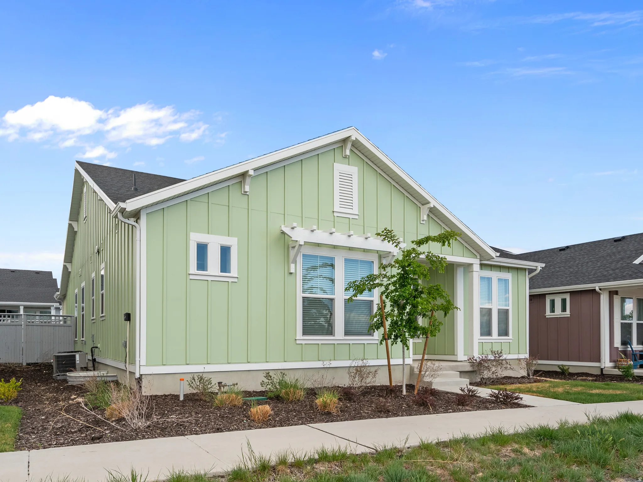 View of front facade featuring board and batten siding