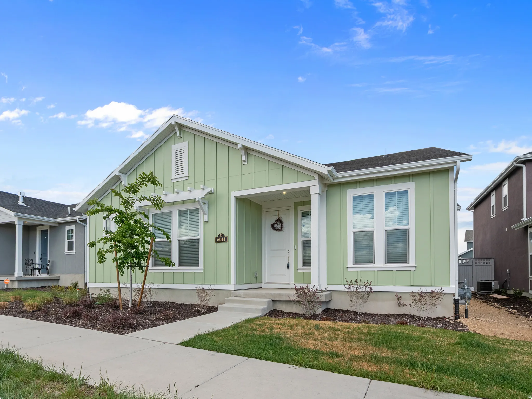View of front facade with board and batten siding