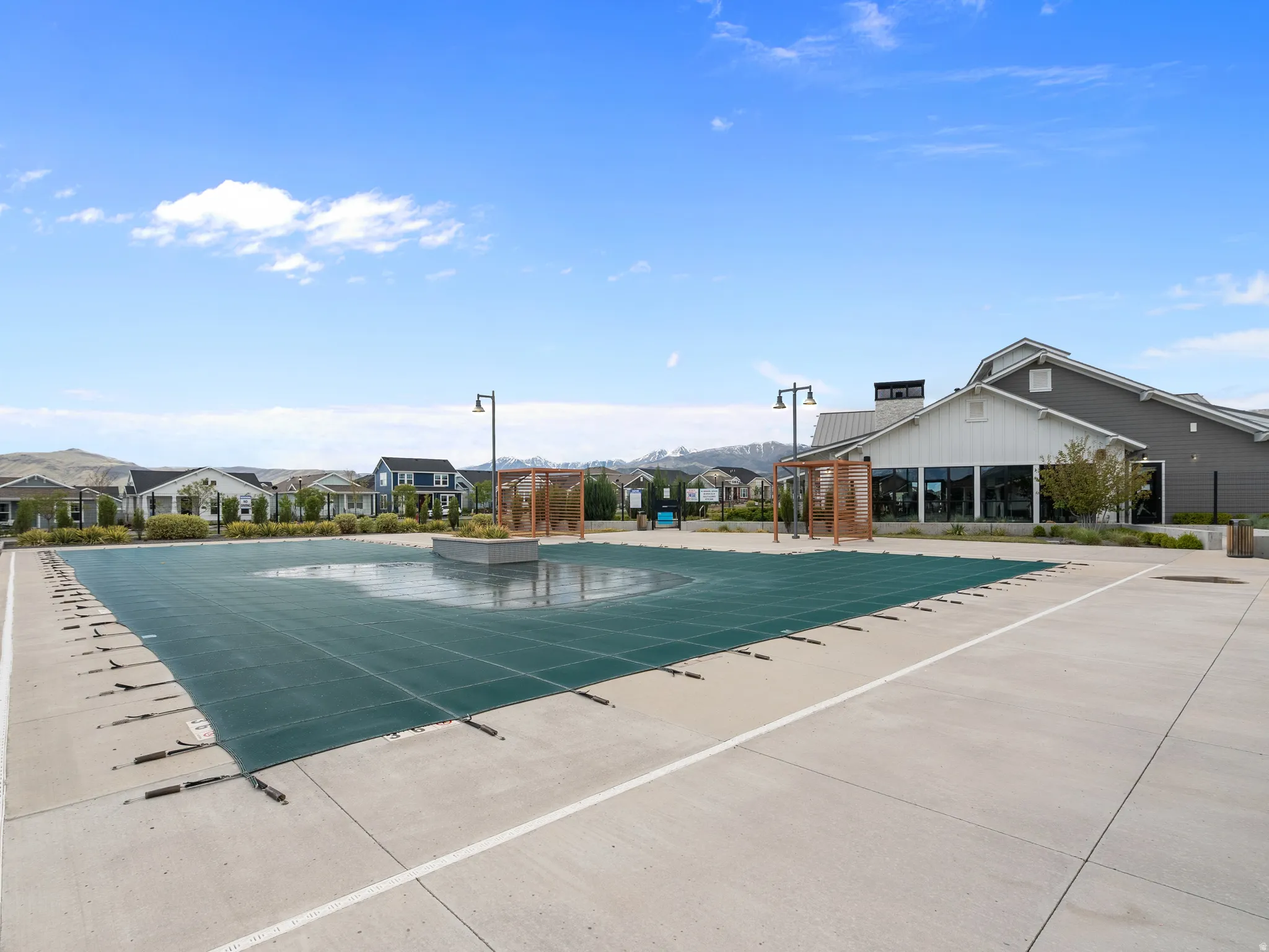 Community pool featuring a residential view and a patio area