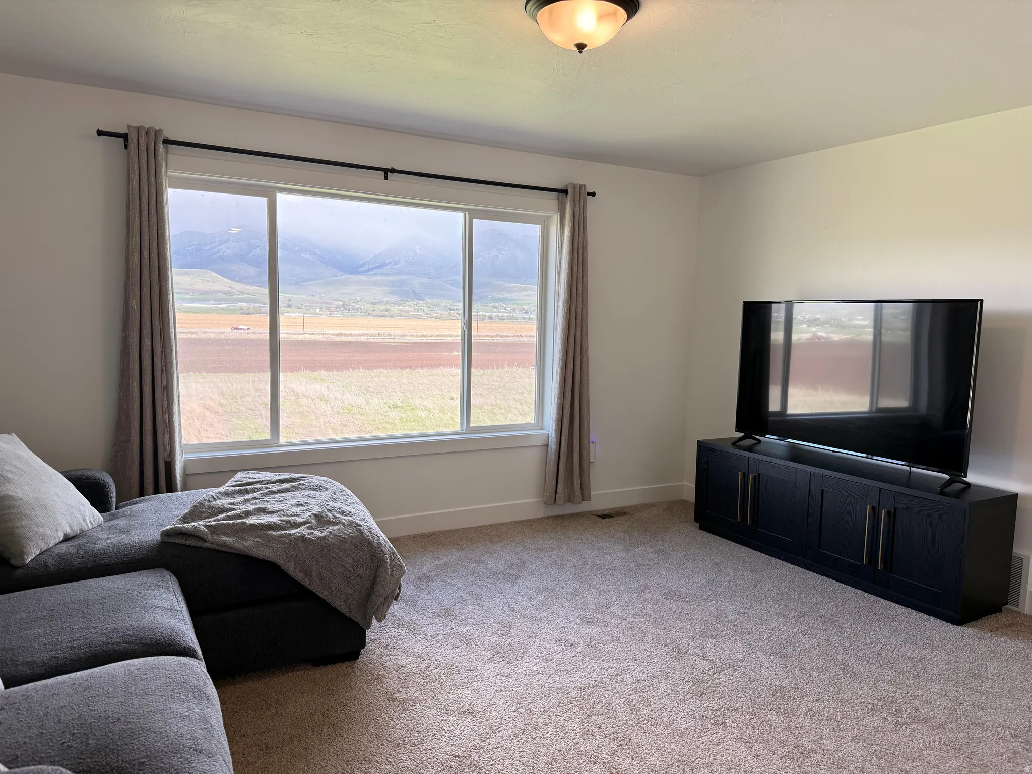Living area with carpet floors and baseboards