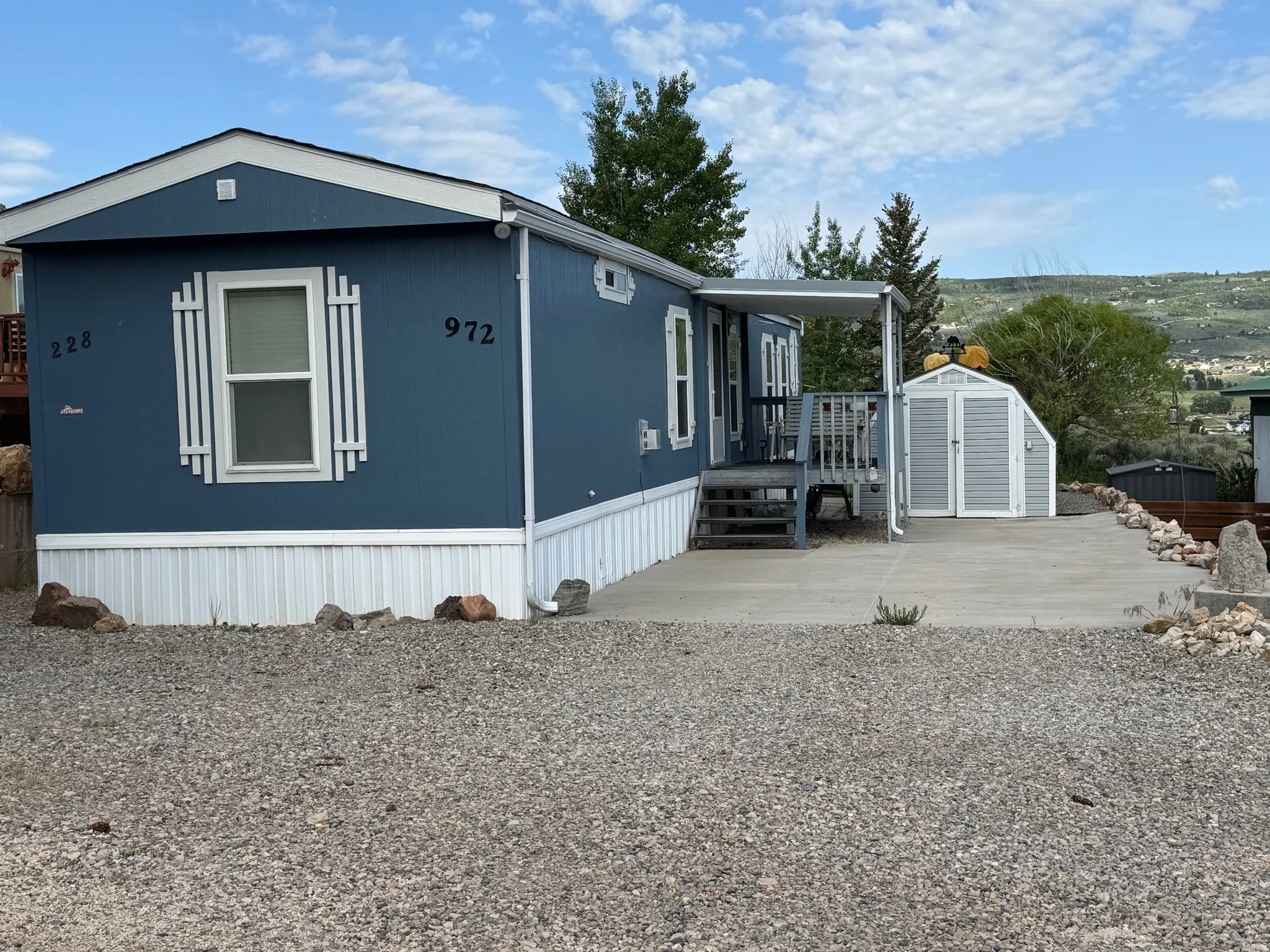 View of front facade featuring a storage shed