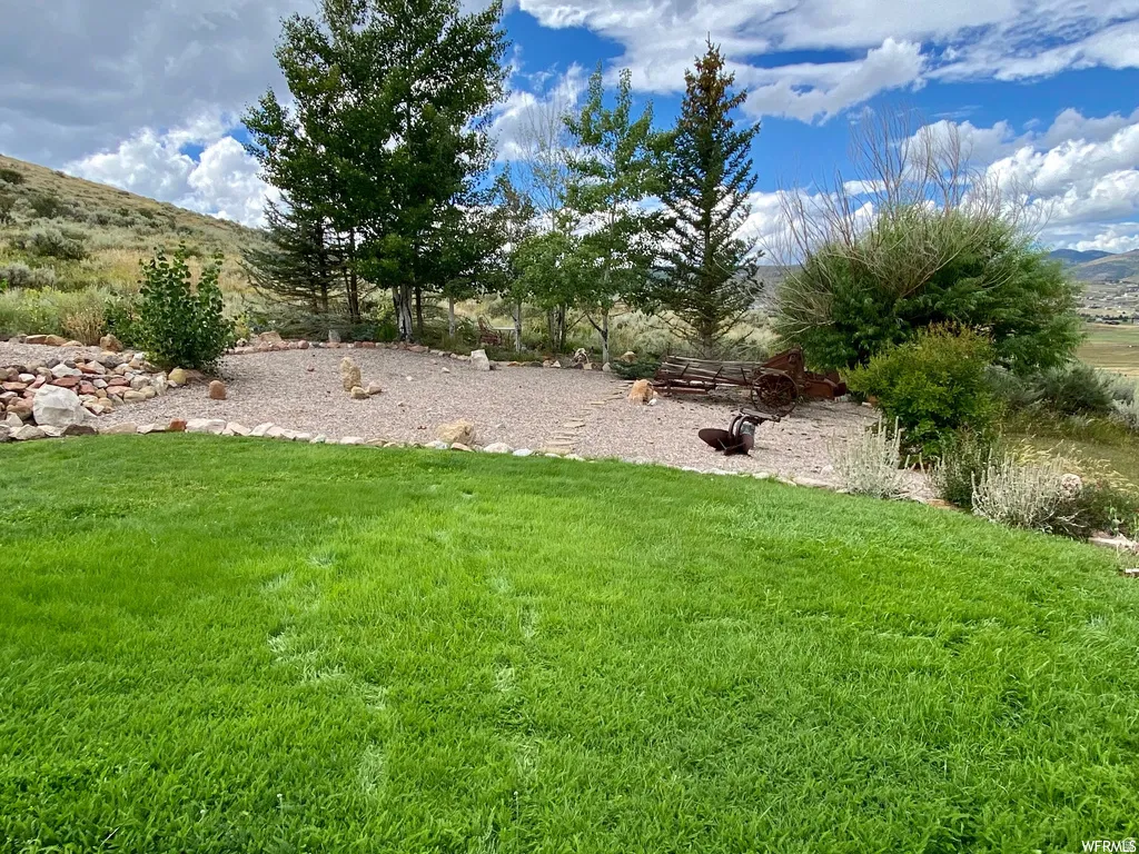 View of green lawn with a mountain view