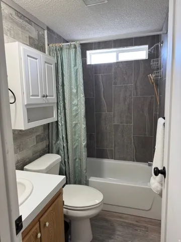 2nd Bathroom with vanity, shower / tub combo