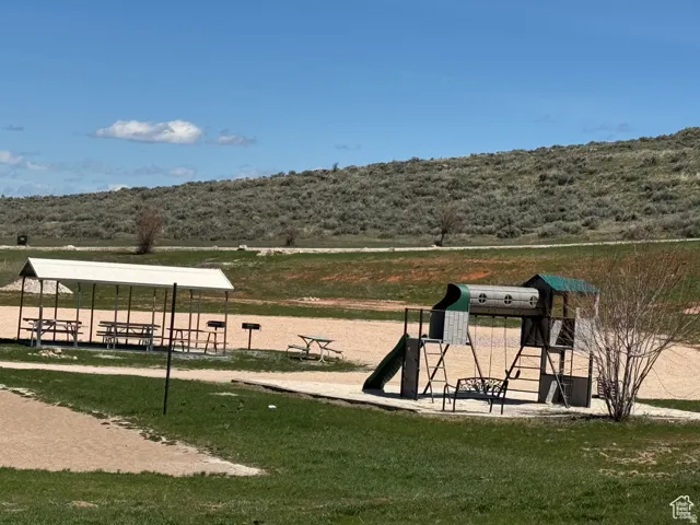 View of home's community playground and groupl even area