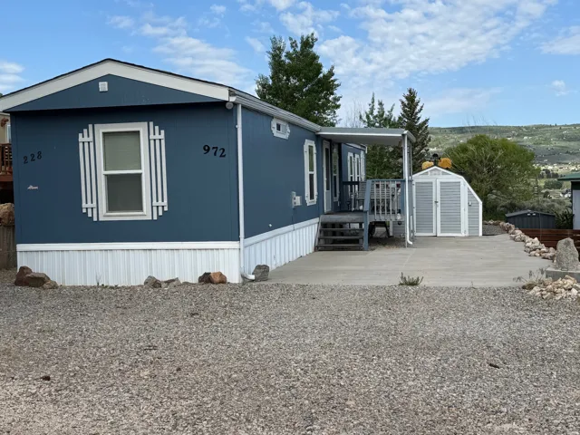View of front facade featuring a storage shed