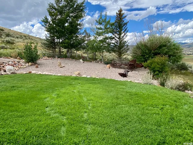 View of green lawn with a mountain view