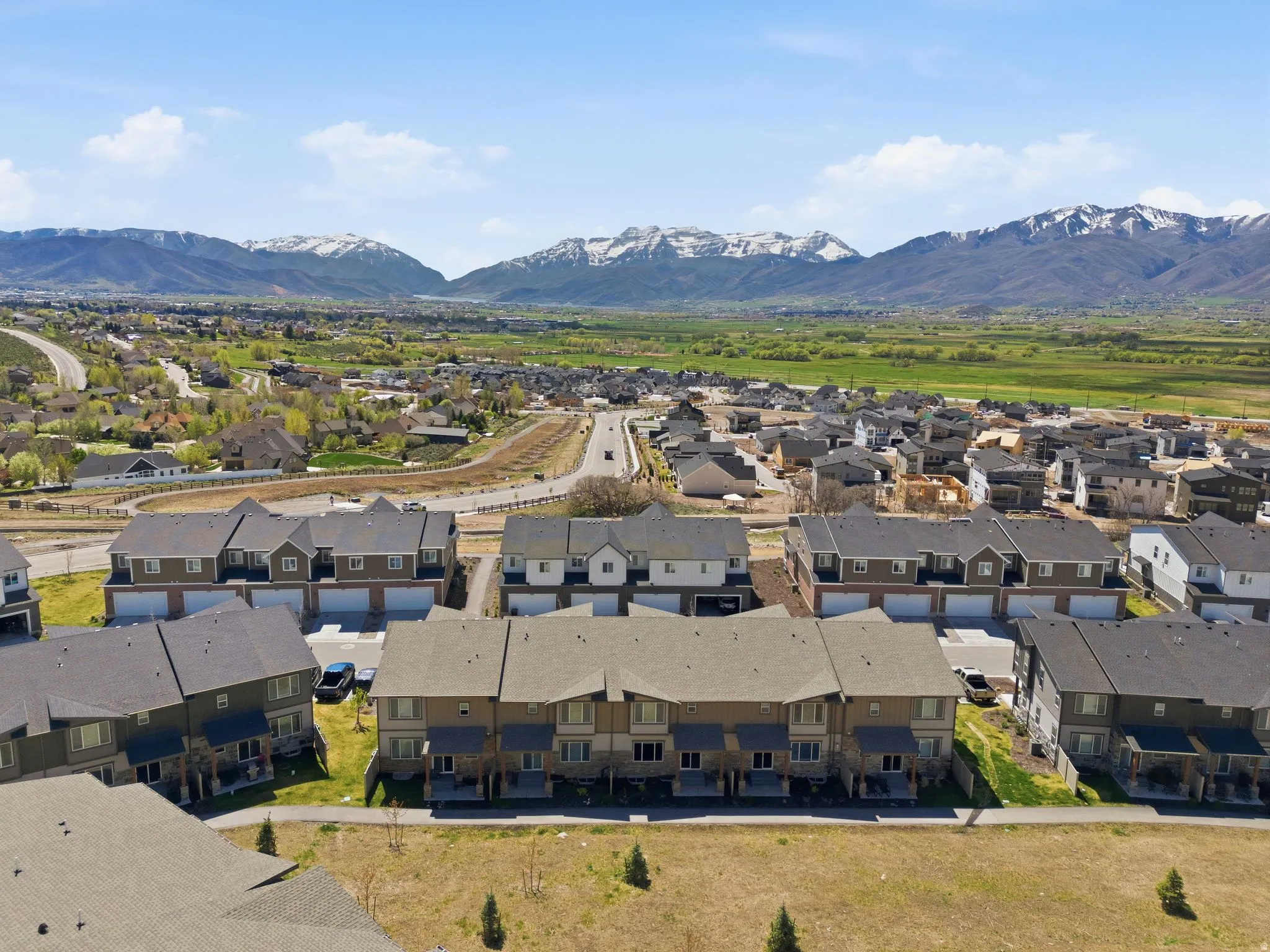Aerial view of residential area featuring a mountainous background