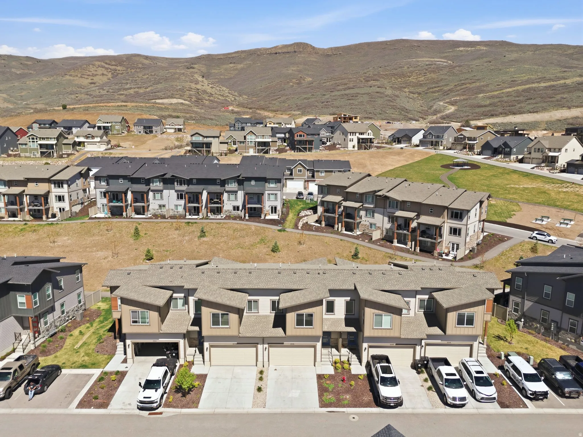 Aerial view of residential area featuring a mountainous background