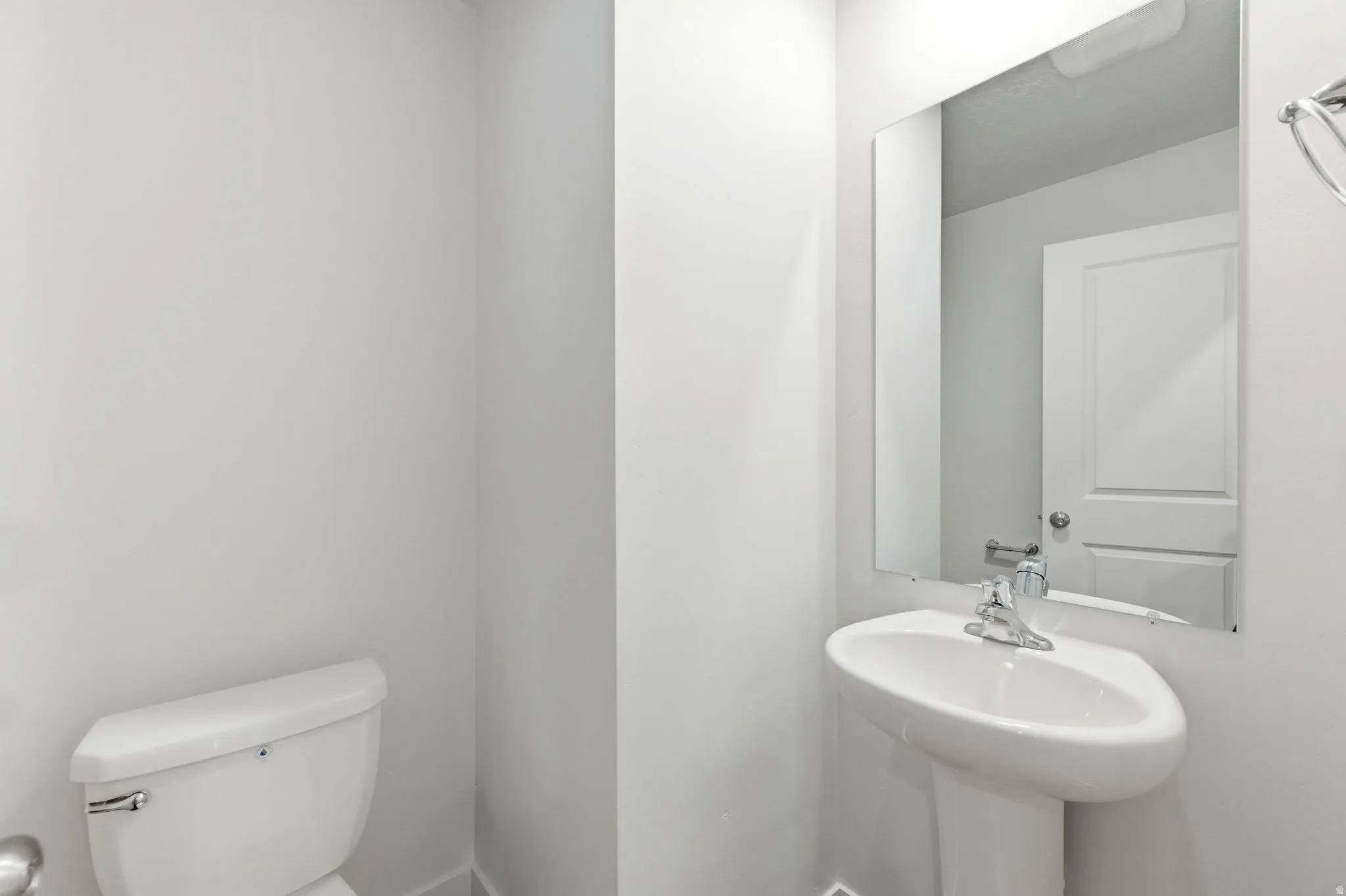 Bathroom featuring toilet and baseboards