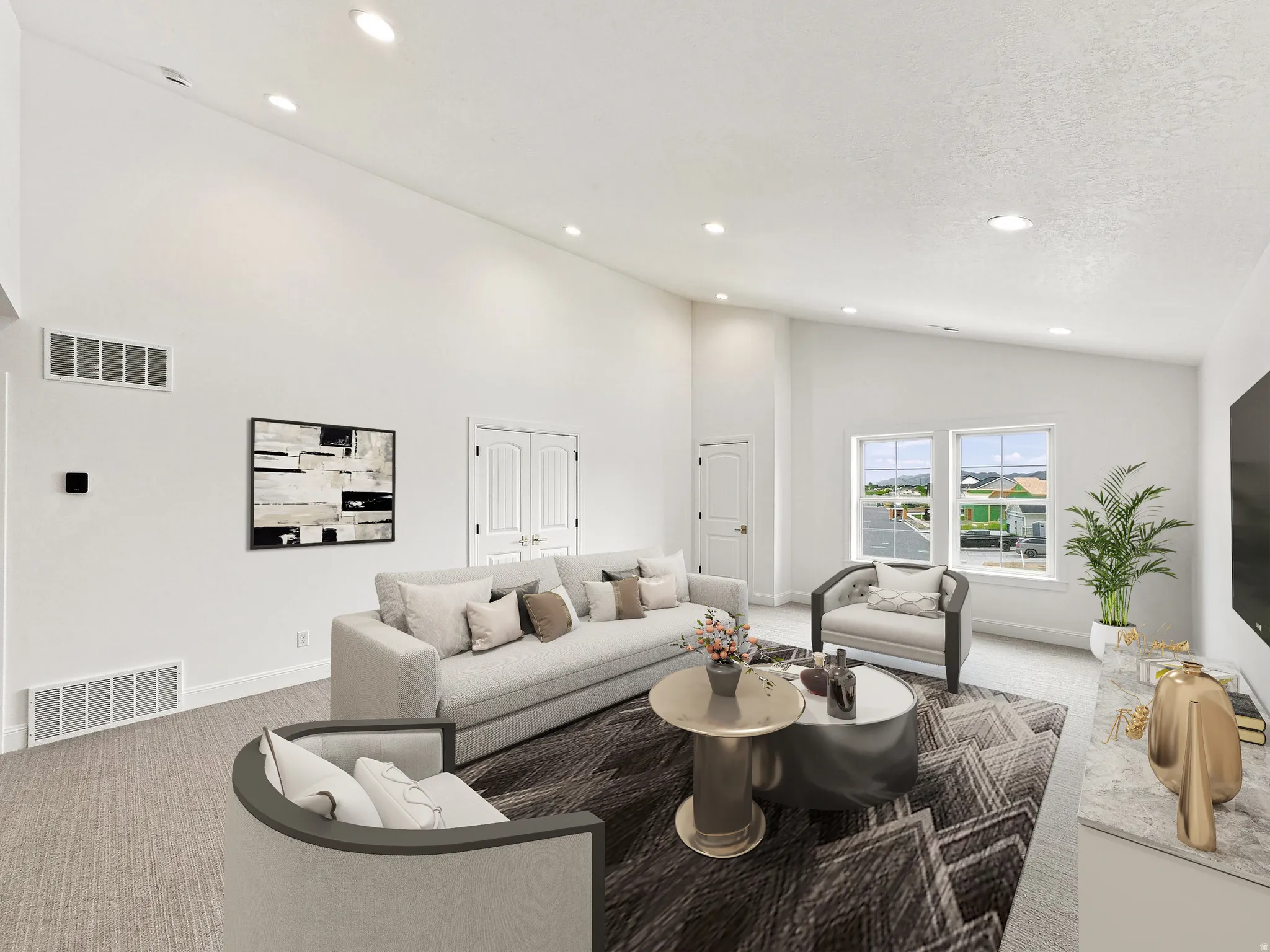 Vaulted ceilings, recessed lighting, double windows, white trim, and light-colored wall-to-wall carpeting