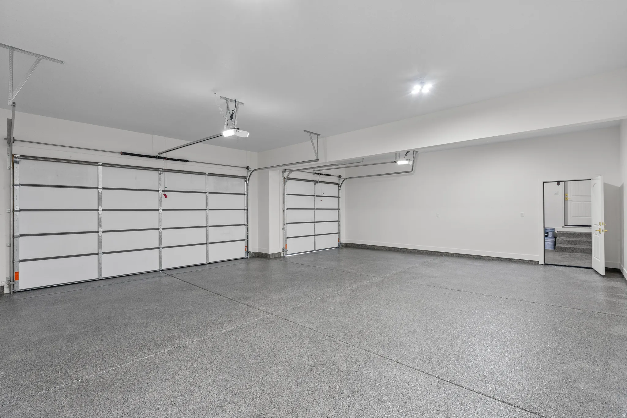 Garage featuring baseboards