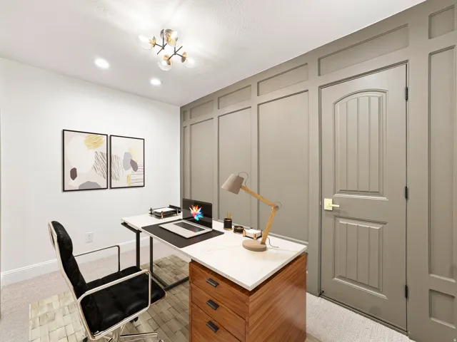 Recessed lighting, contemporary chandelier, paneled accent wall, arched interior door, and light-colored carpeting